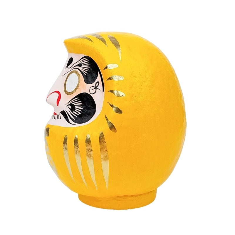 Daruma amarillo japonés