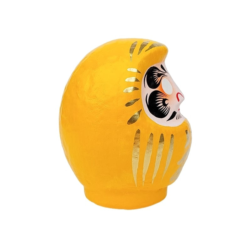 Daruma amarillo japonés