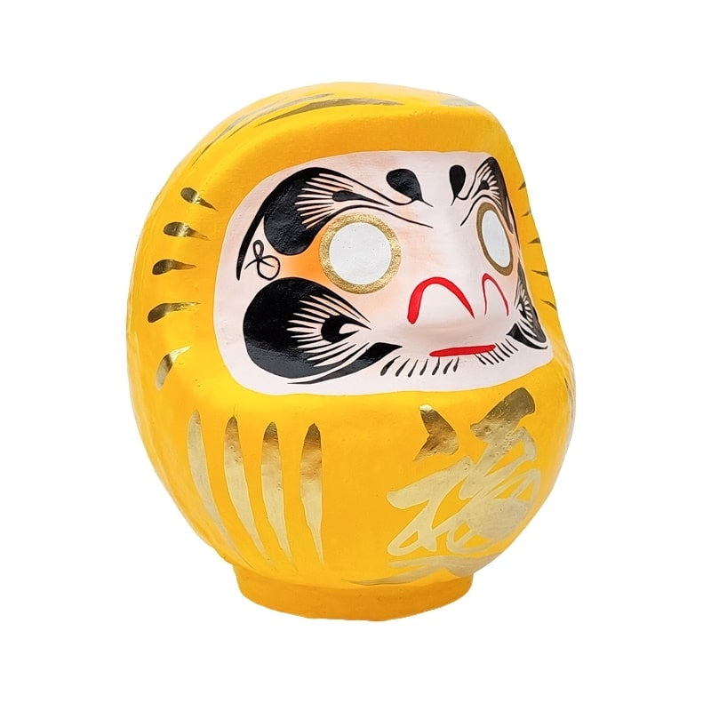 Daruma amarillo japonés