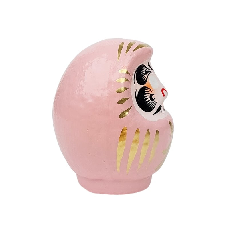 Daruma rosa japonés