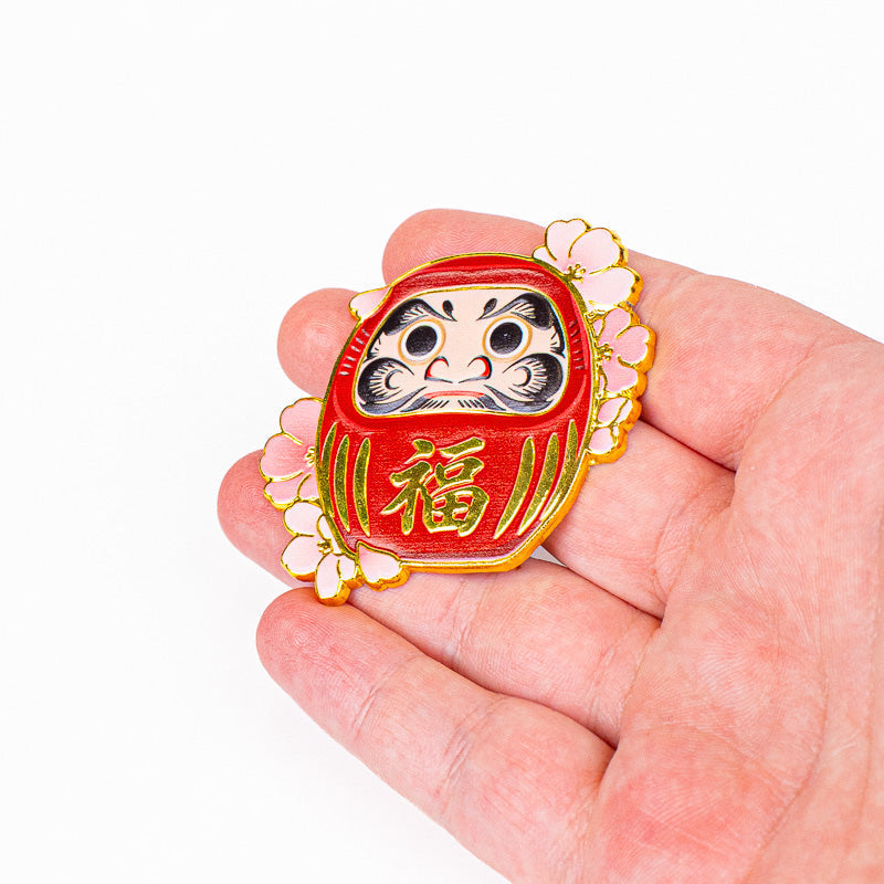 Iman japonés de metal con motivos de Daruma y Sakura